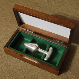 Three objects in sterling re-enacting the drama of a crucifixion.