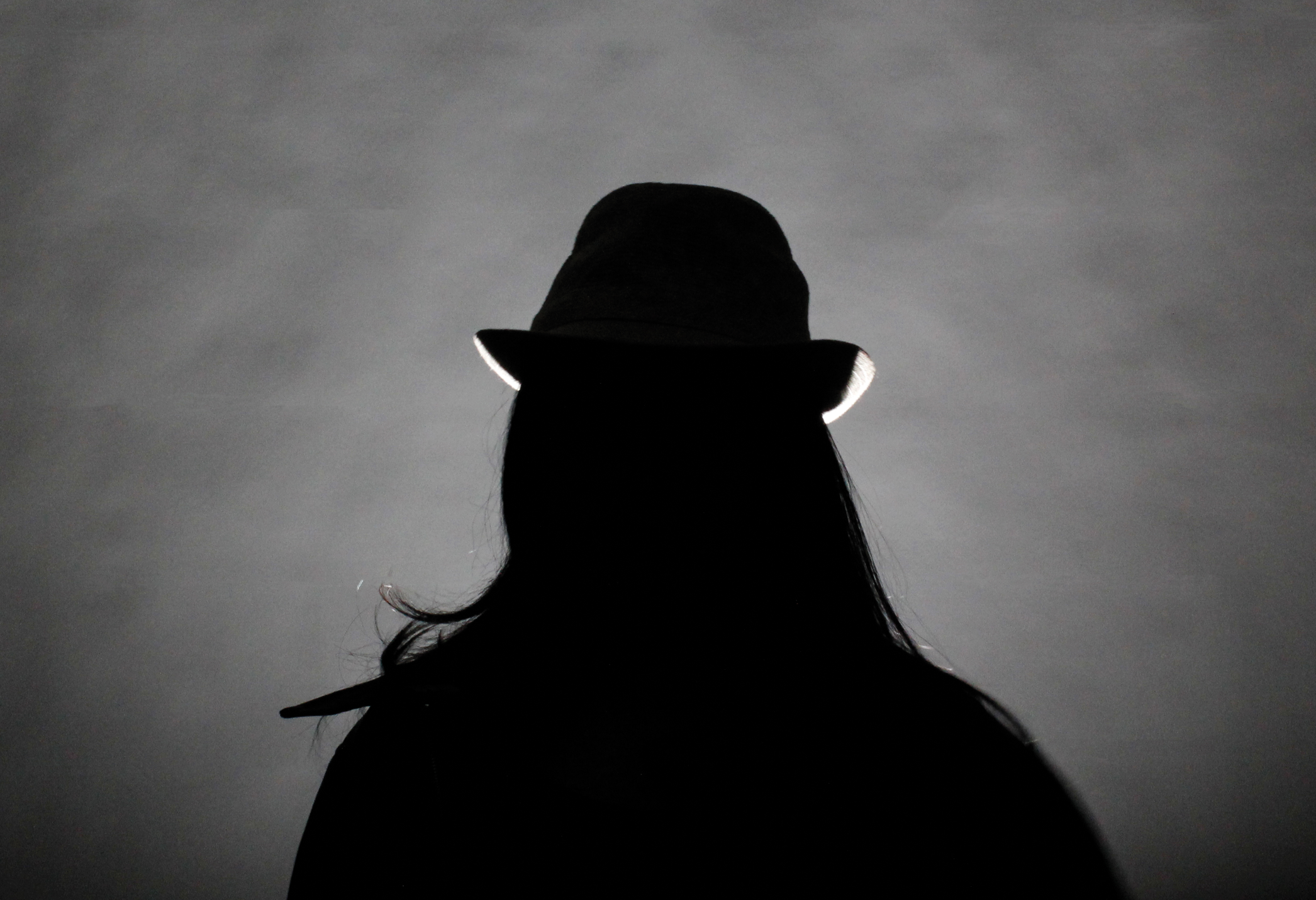 A Face Half-Lit, A Face Still Concealed