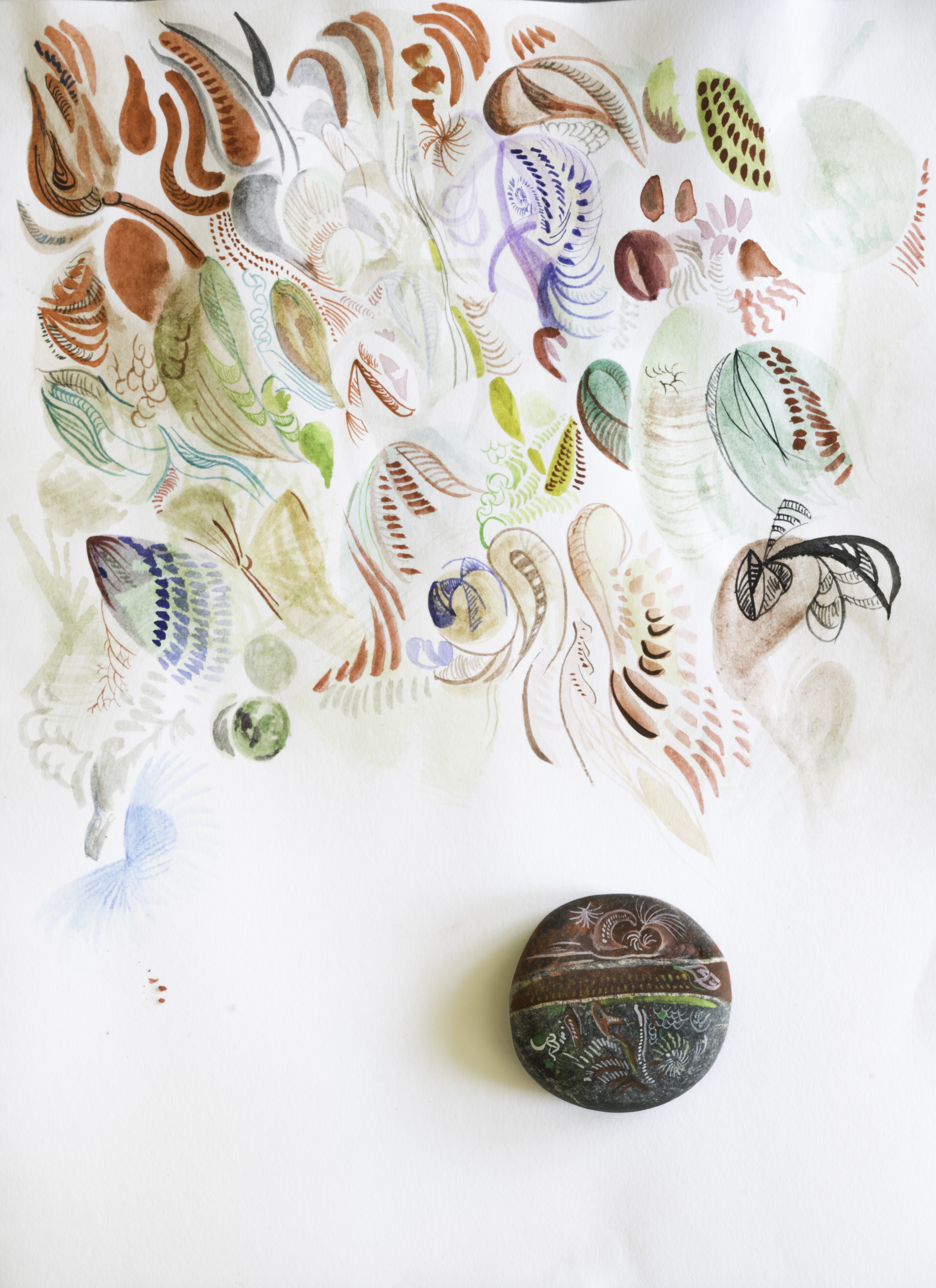 Tales of Pebbles - A miniature installation: one pebble covered with watercolour pigments rested upon a watercolour painting, with which visual adventure expresses and concludes my sensation of the pebble's passage of time in the form of automated colour drawings